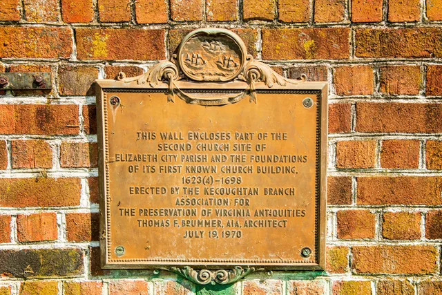 The plaque on the wall at St. John's second church site
