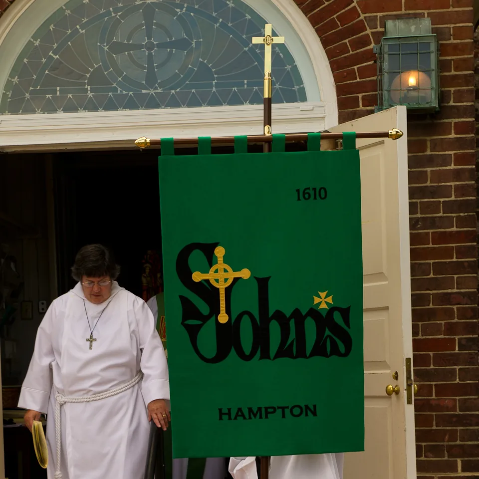 The St. John's banner carried out through the church door