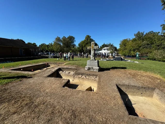 Excavation units and the memorial cross at the second church site