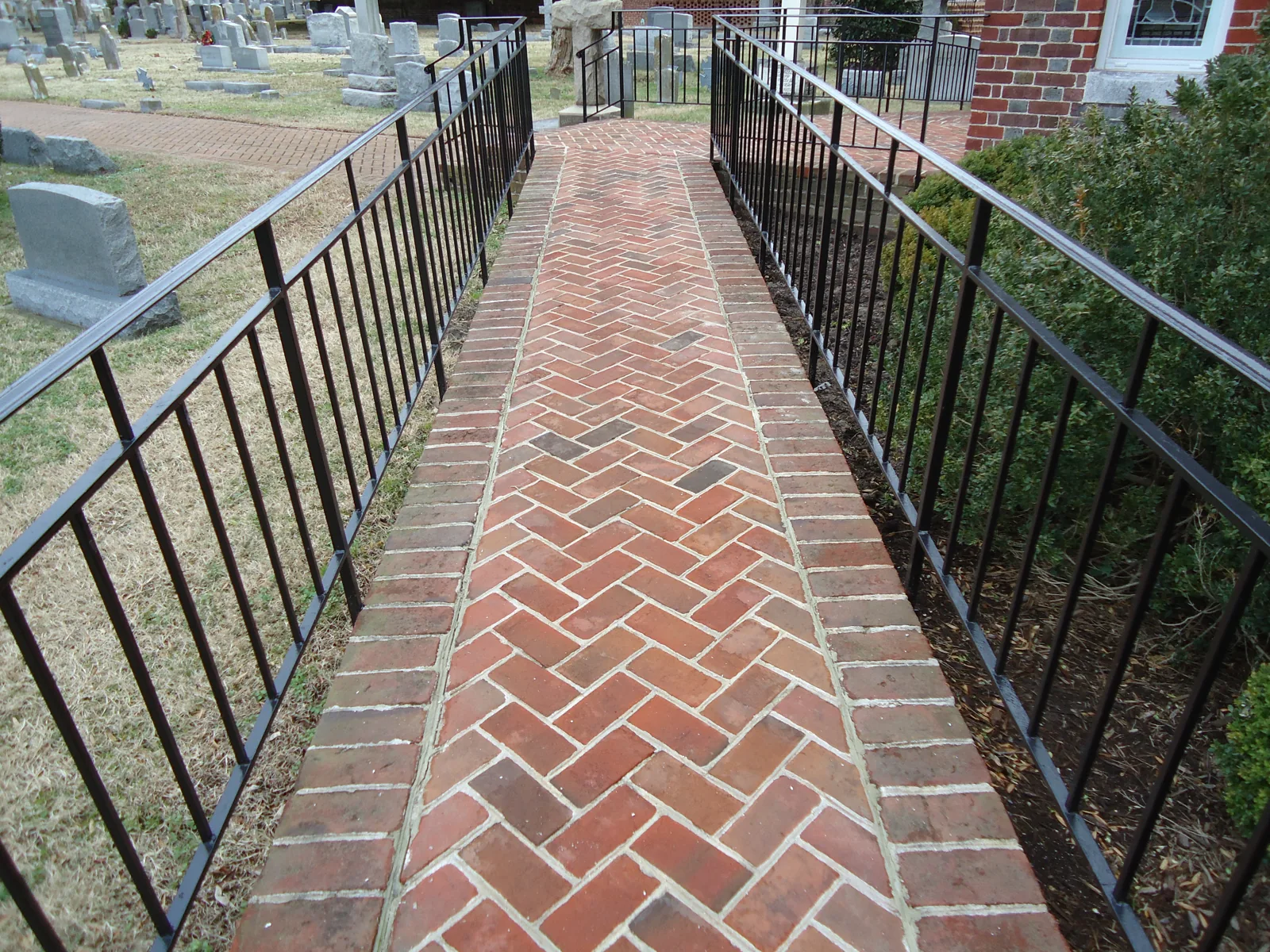 The herringbone brick walkway through the churchyard