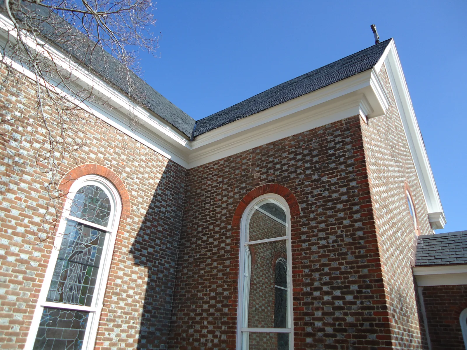 The church's slate roof and arched windows
