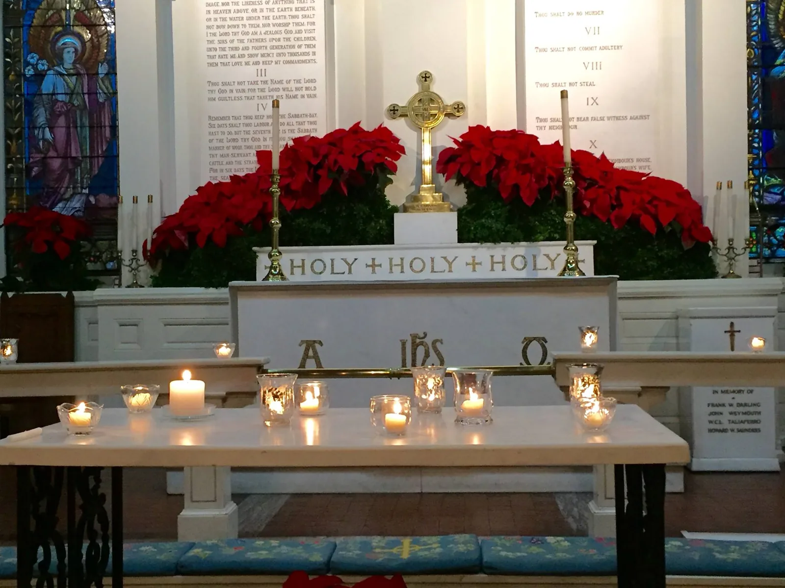 The altar set with candles and poinsettias for a Taizé service