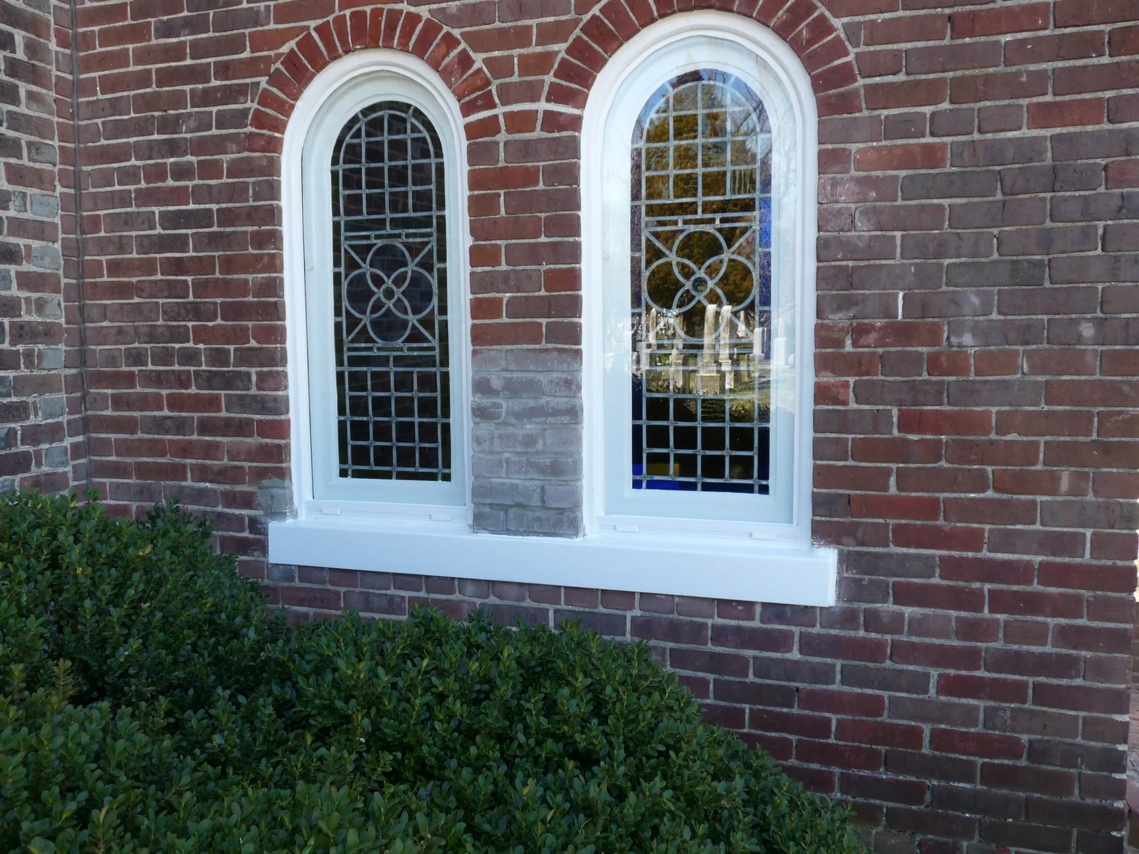Restored windows in the church's brick wall