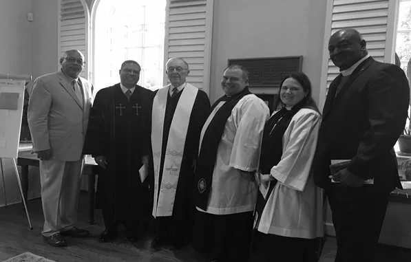 Clergy and speakers at the CommUNITY service in the church