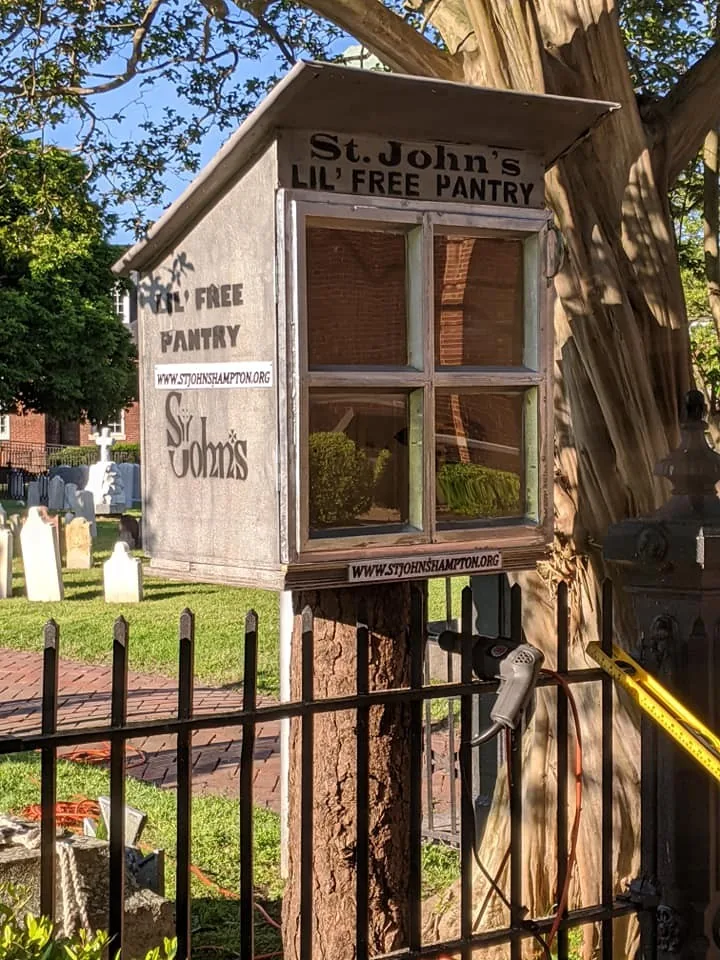 St. John's Lil' Free Pantry beside the churchyard fence