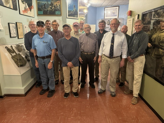 The men of the parish gathered for a group photo among the exhibits at the Virginia War Museum